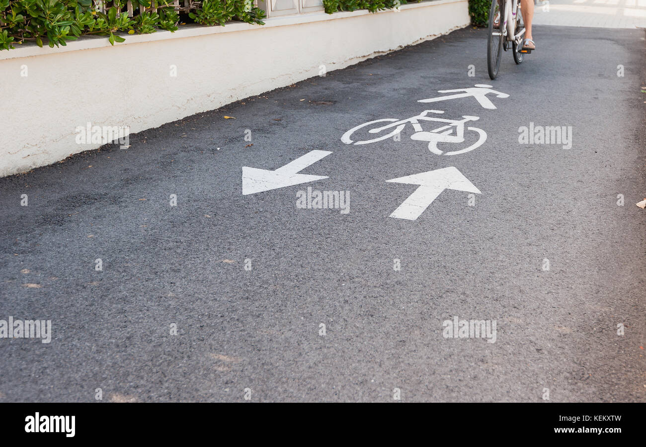 Bicycle road sign and arrow. A bike lane for cyclist. Stock Photo