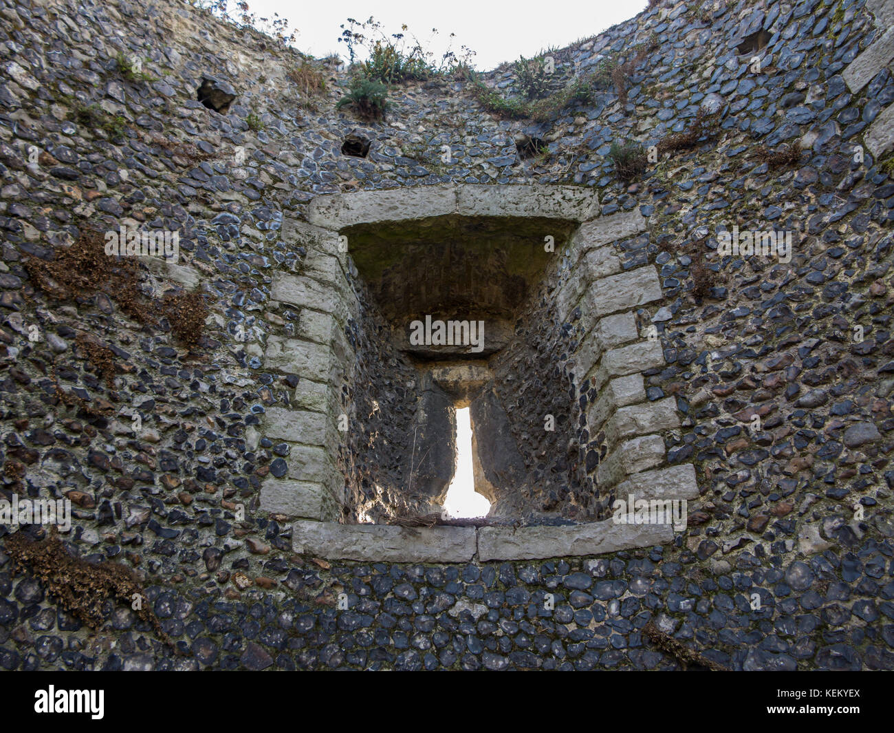 An arrowslit in a medieval wall Stock Photo