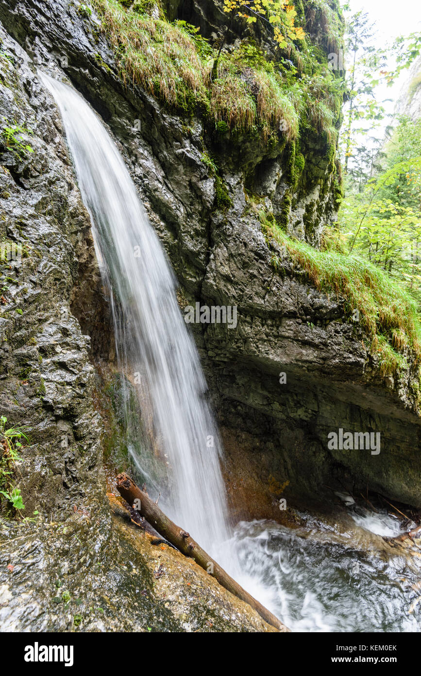 large Waterfall from ravine in autumn, long exposure, in mountain river ...