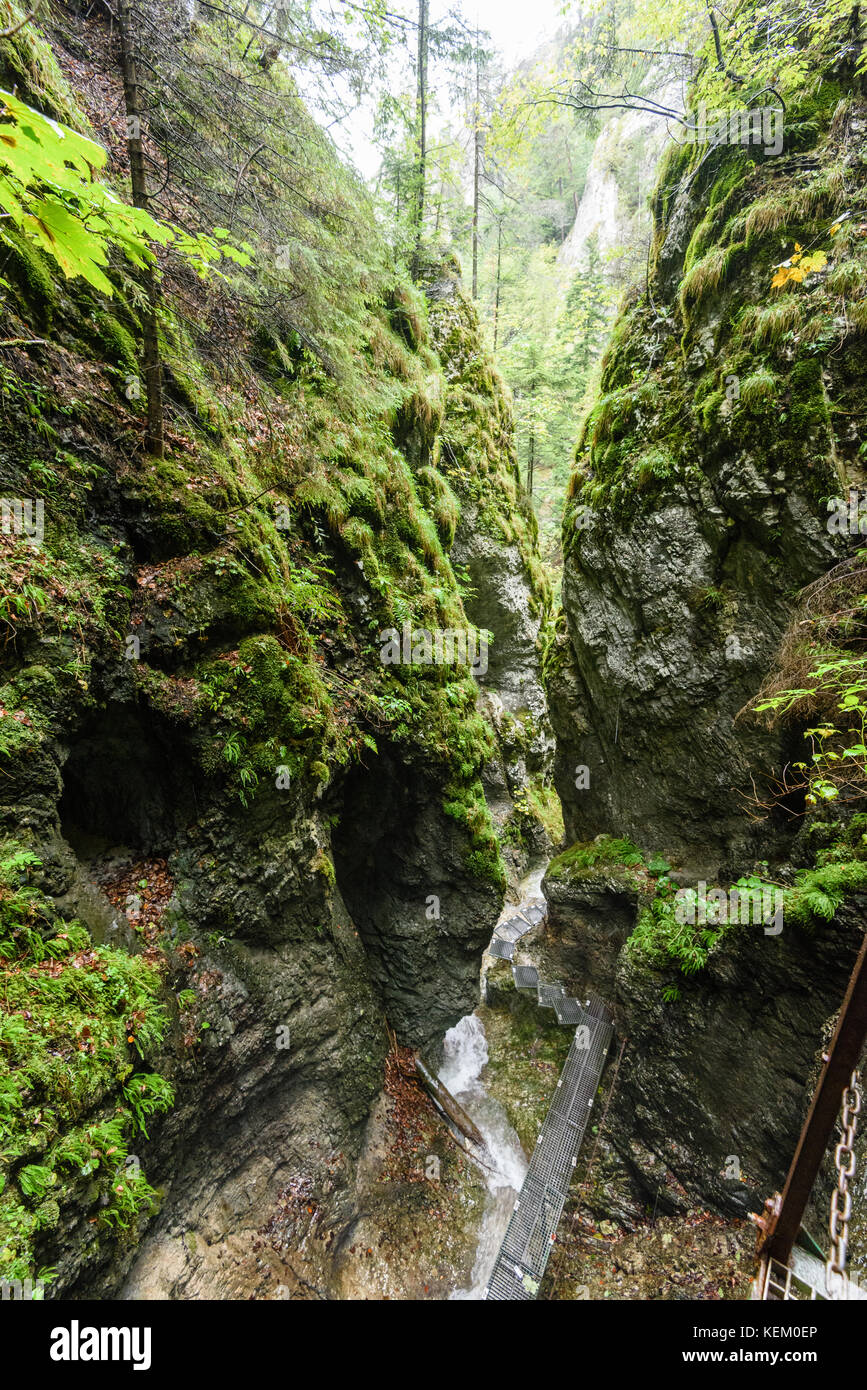 large Waterfall from ravine in autumn, long exposure, in mountain river ...