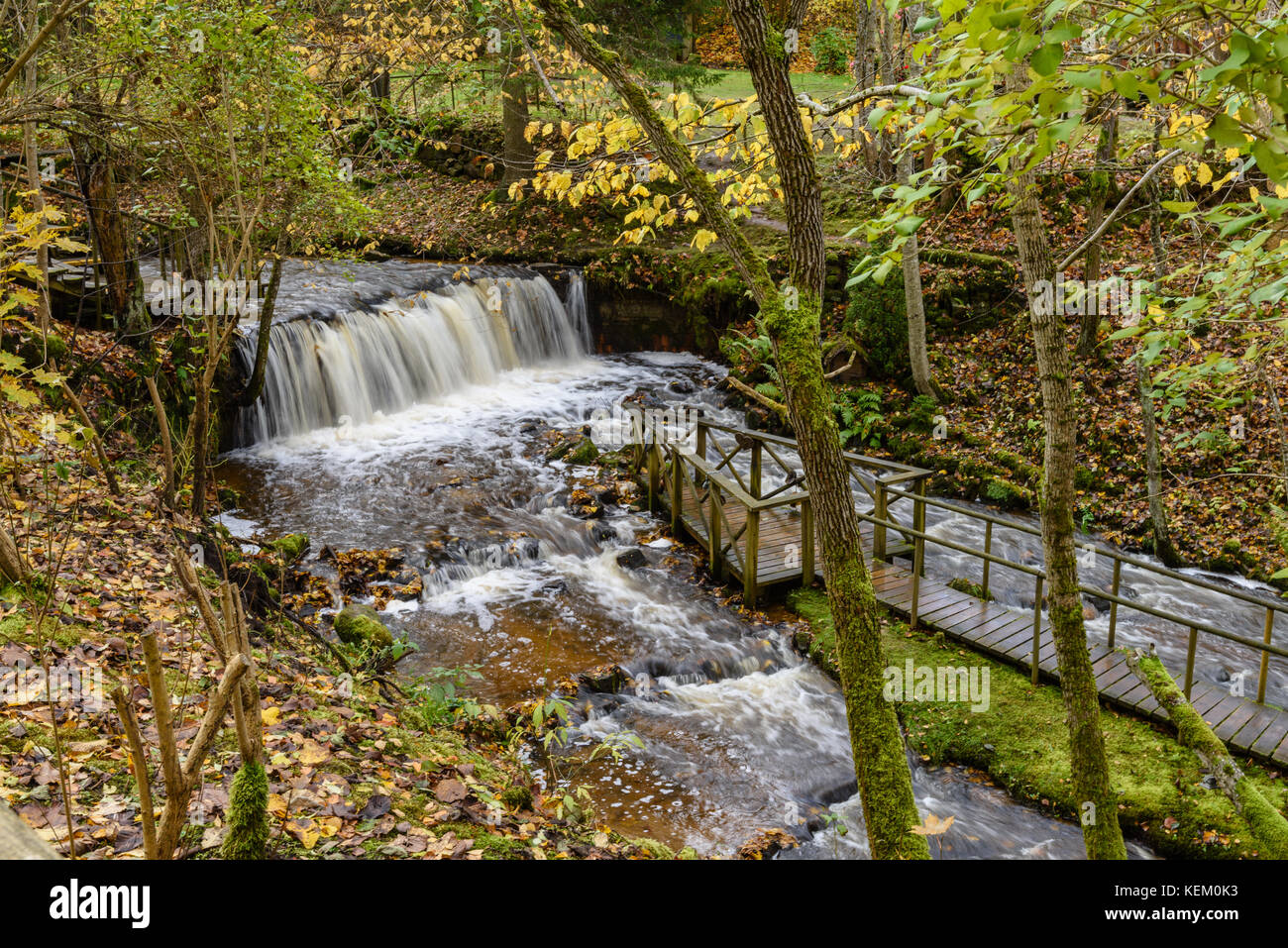 Waterfall from ravine in autumn, long exposure, in mountain river with ...