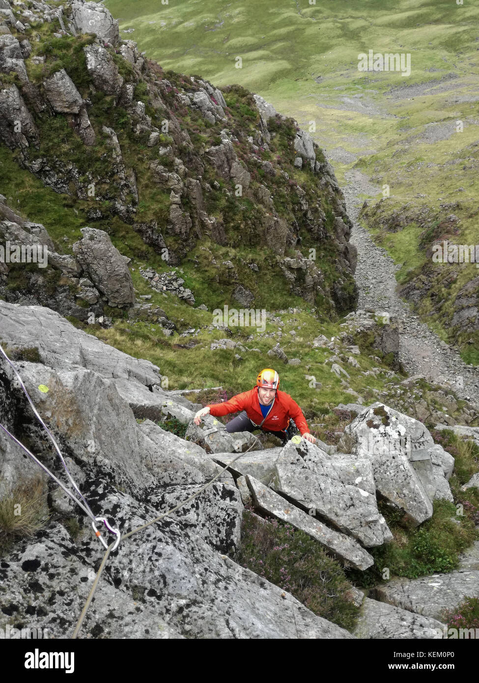 A rock climber on Gillercombe Buttress, a Classic Rock climb on Gillercombe Crag, Borrowdale, Lake District National Park Stock Photo