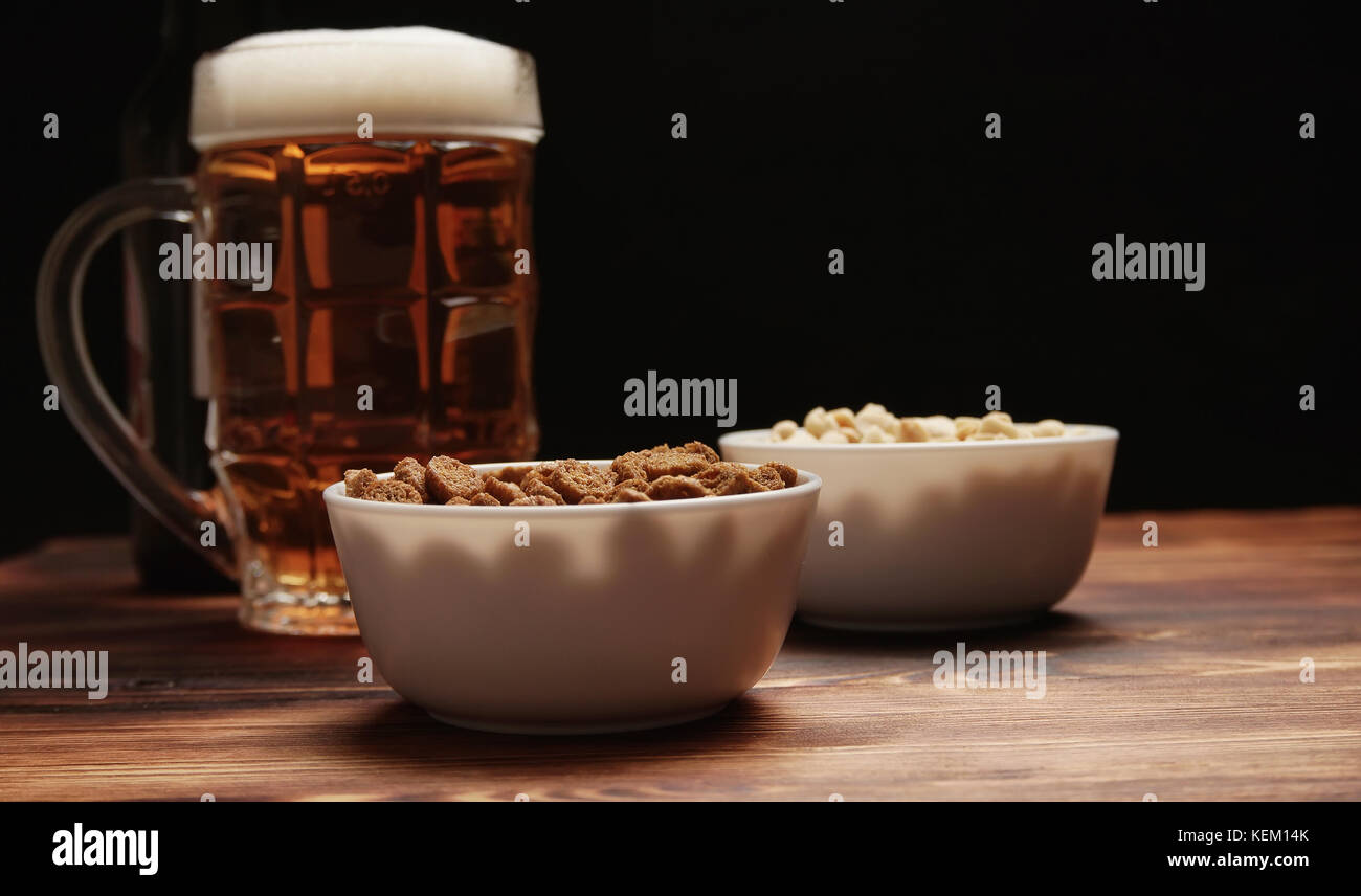 Beer in a mug and snack Stock Photo Alamy