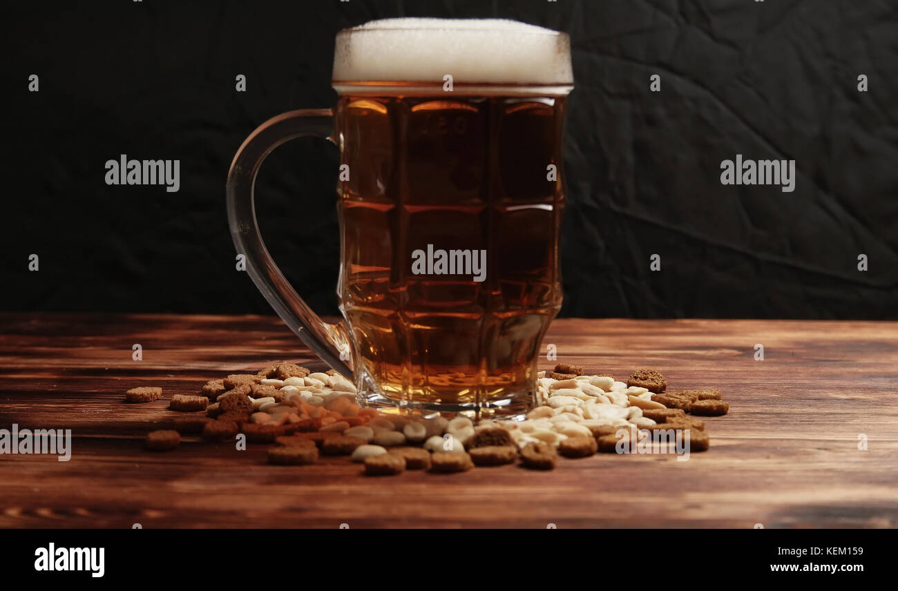 Beer in a mug and snack Stock Photo Alamy
