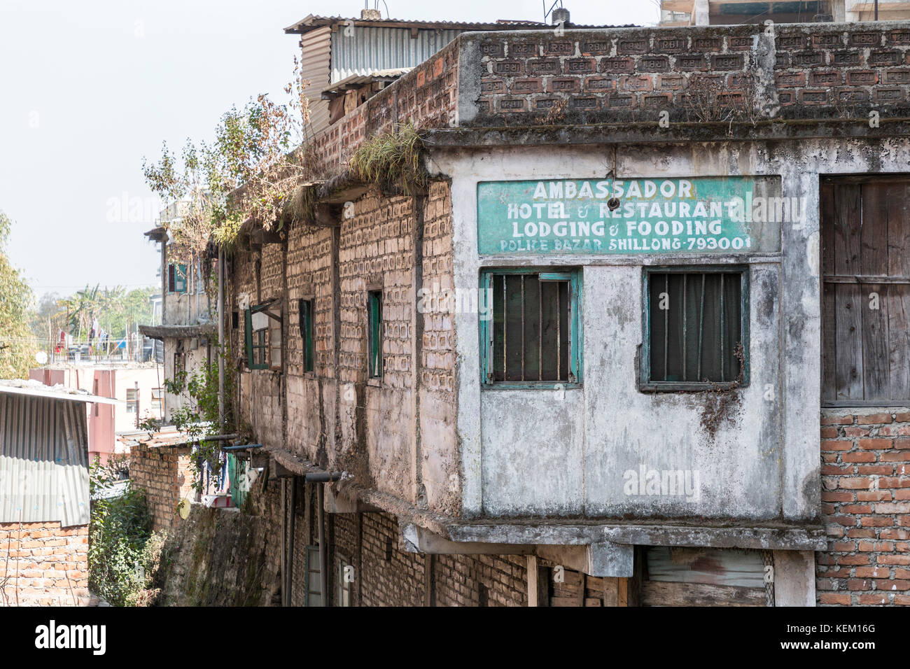 Hotel and restaurant sign on delapidated building, Shillong, Meghalaya, India Stock Photo