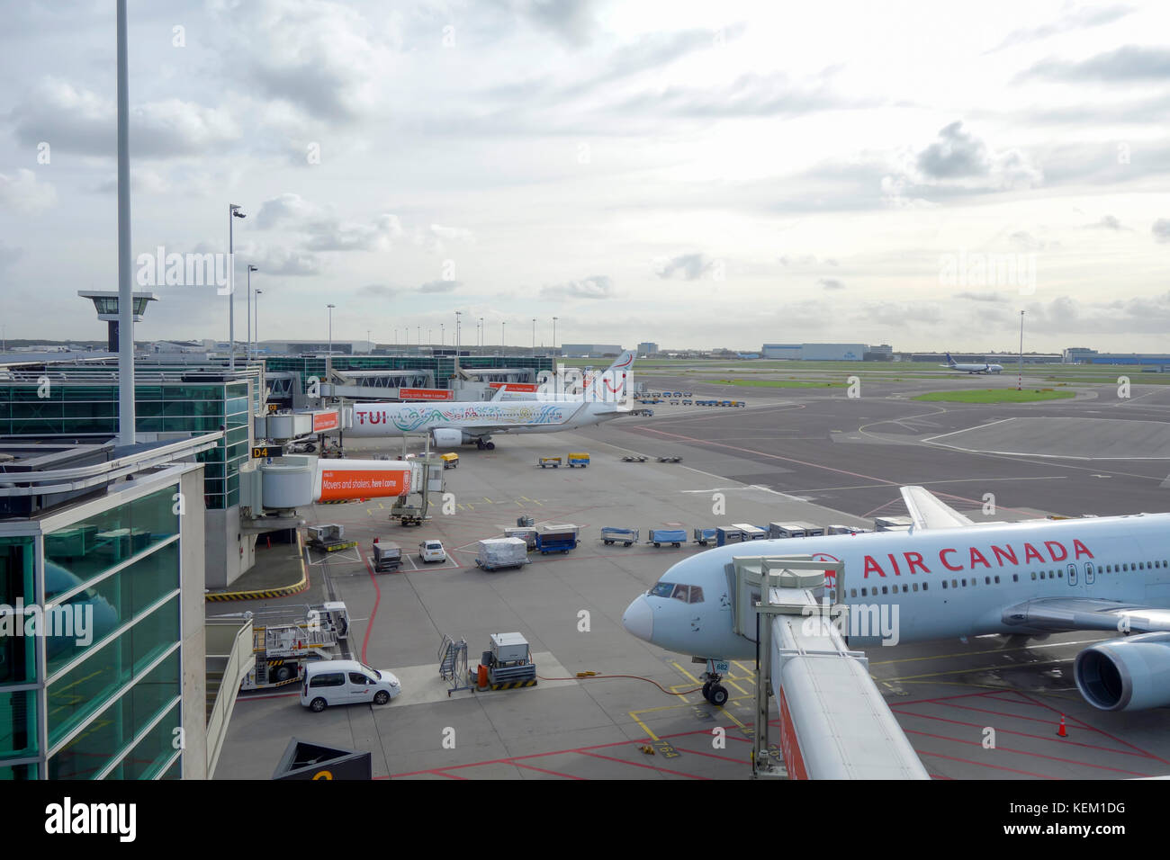 Air Canada and TUI aircraft on the runway awaiting departure at Amsterdam Schiphol Airport Stock Photo
