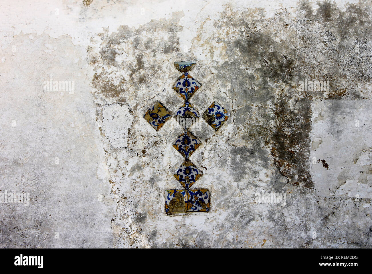 A Christian cross made of azulejo, a kind of glazed coloured tile traditionally used in Spanish and Portuguese buildings Stock Photo