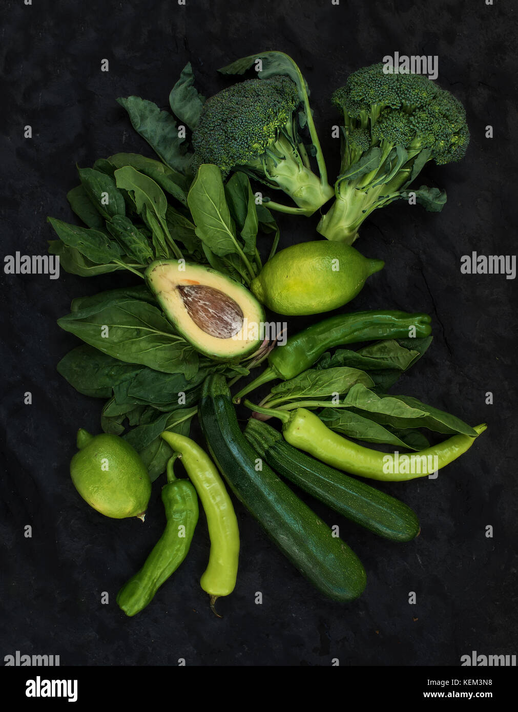 Raw green vegetables set. Broccoli, avocado, pepper, spinach, lime on