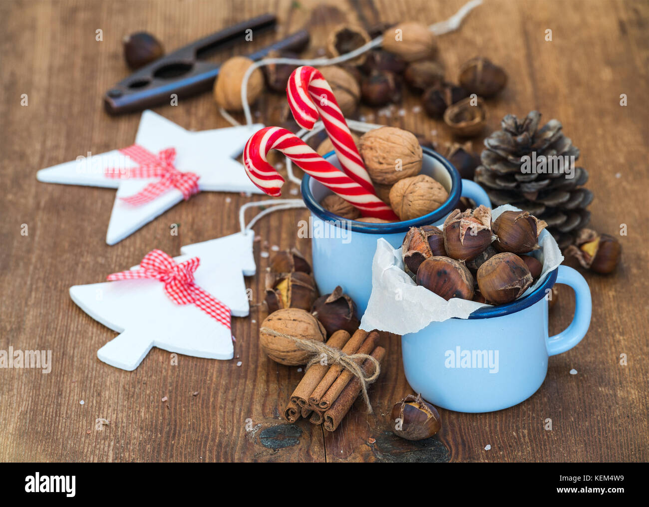 Traditional Christmas foods and decoration. Roasted chestnuts in blue