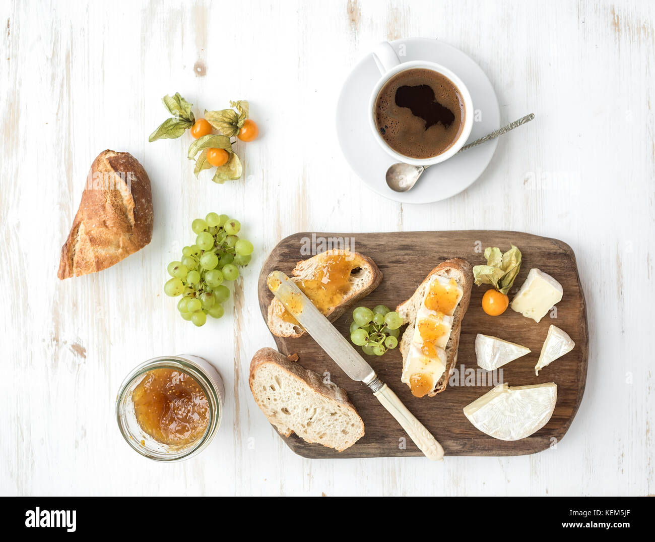 Breakfast set. Brie cheese and fig jam sandwiches with fresh grapes