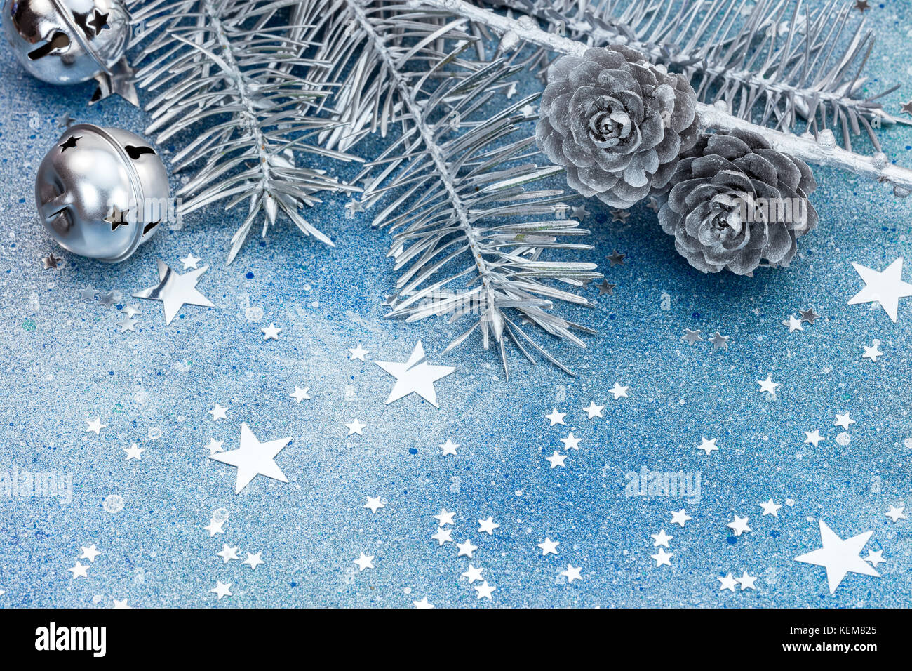 silver christmas tree branches with cones and jingle bells. sparkling Stock  Photo - Alamy