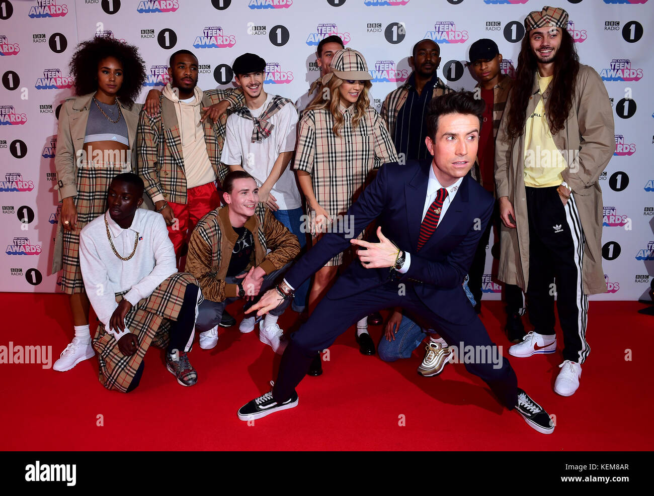 Rita Ora (centre back) and Nick Grimshaw (front) attending BBC Radio 1's Teen Awards, at the SSE Arena, Wembley, London. Stock Photo