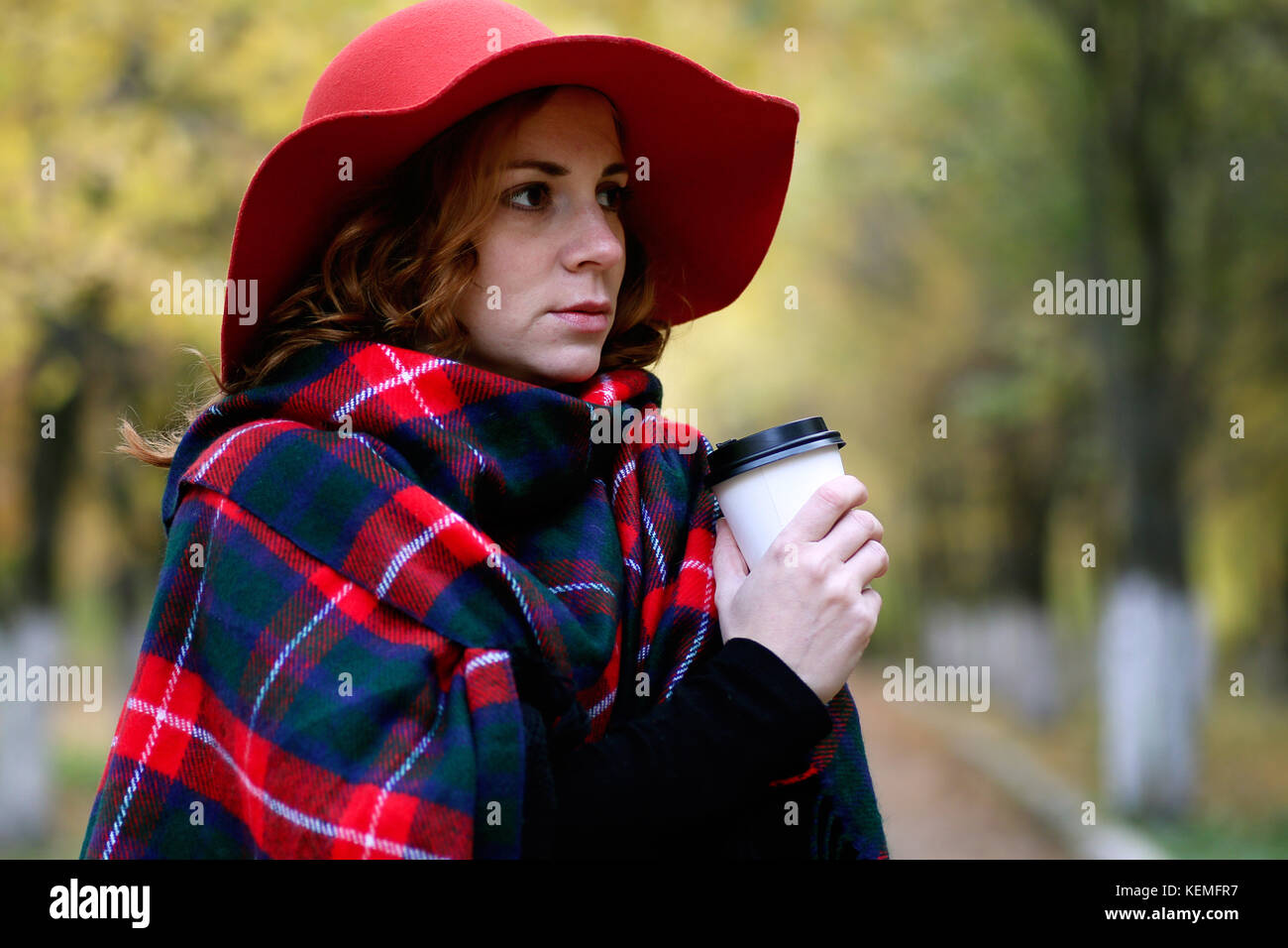 Girl on a walk in an autumn park Stock Photo - Alamy