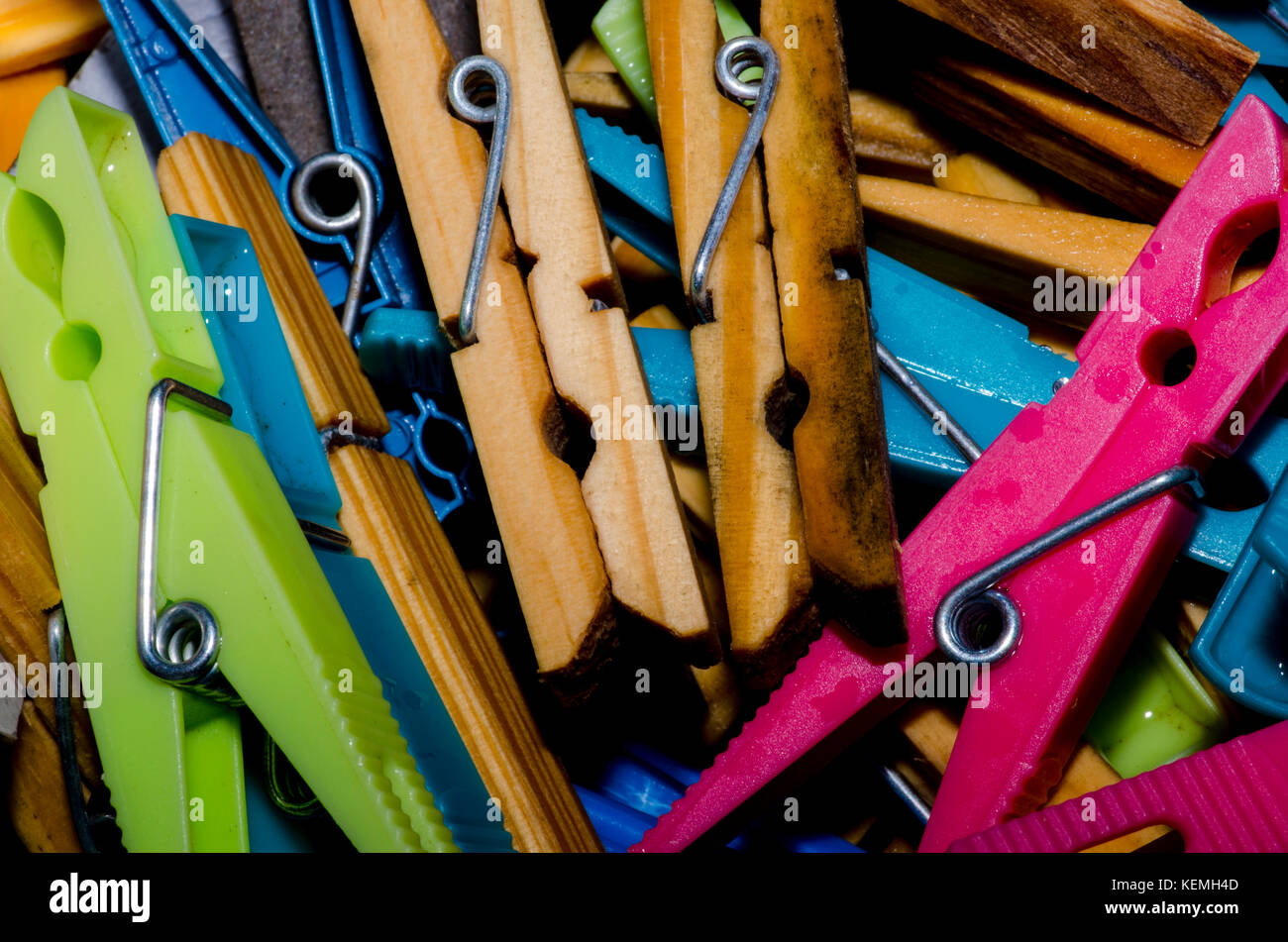 Wooden and plastic clothes pegs Stock Photo