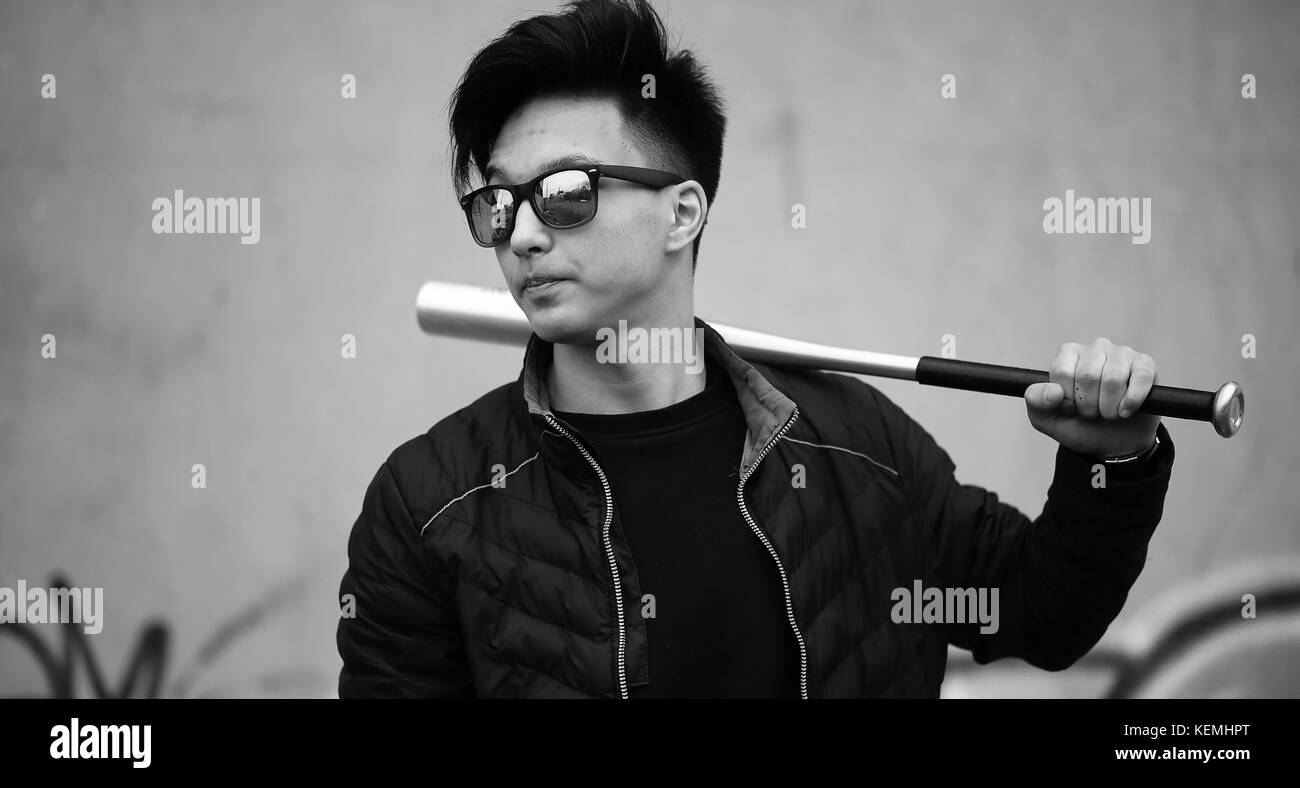 Black White photo of Asian young man outdoors posing Stock Photo - Alamy