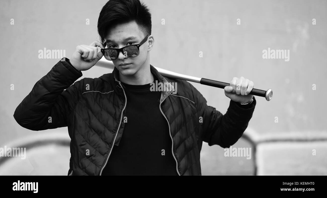 Black White photo of Asian young man outdoors posing Stock Photo - Alamy