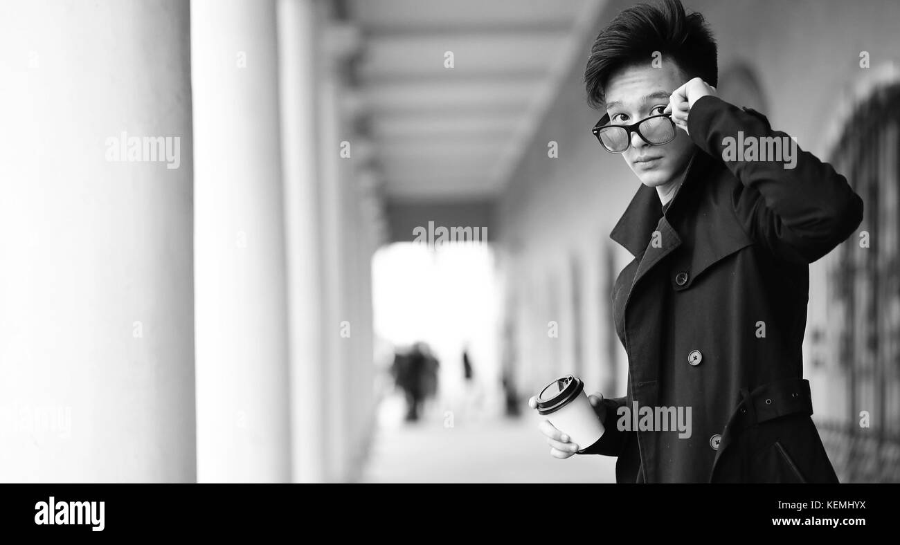 Black White photo of Asian young man outdoors posing Stock Photo - Alamy