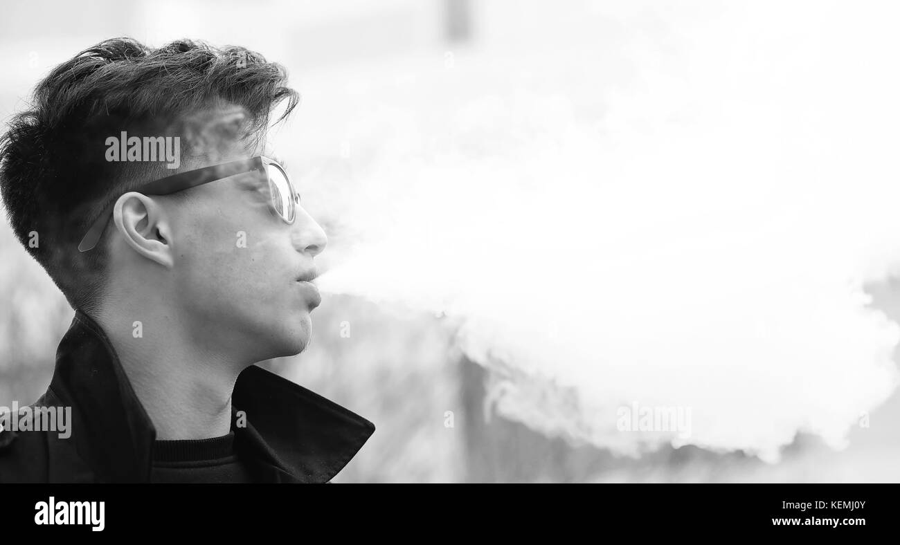 Black White photo of Asian young man outdoors posing Stock Photo - Alamy