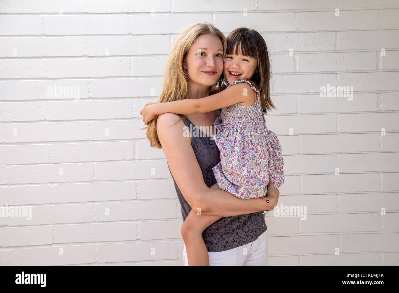 Mother holding her five year old daughter Stock Photo