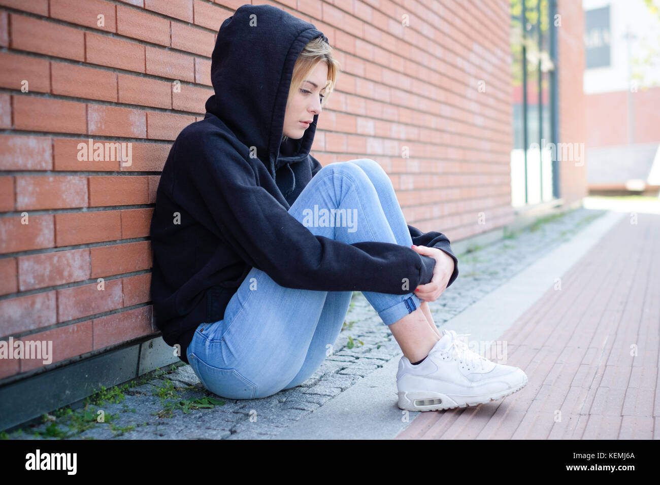 Young girl portrait outdoor feeling alone and sad Stock Photo - Alamy
