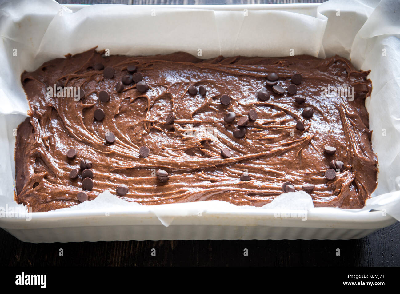 Basic homemade brownie or chocolate cake raw dough in baking pan