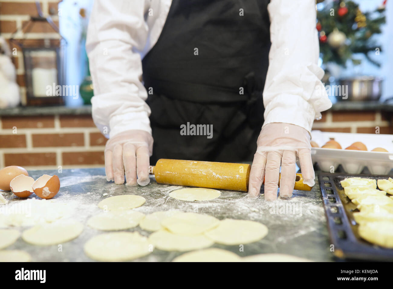 Male chef uses ingredients for preparing flour products on kitch Stock ...