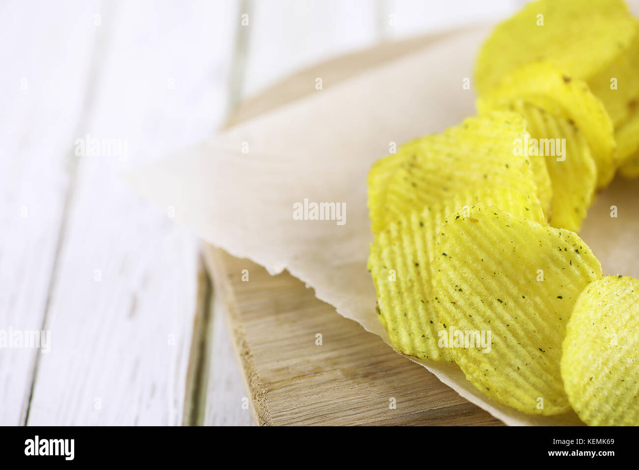 Potato chips on a wooden tray Stock Photo Alamy