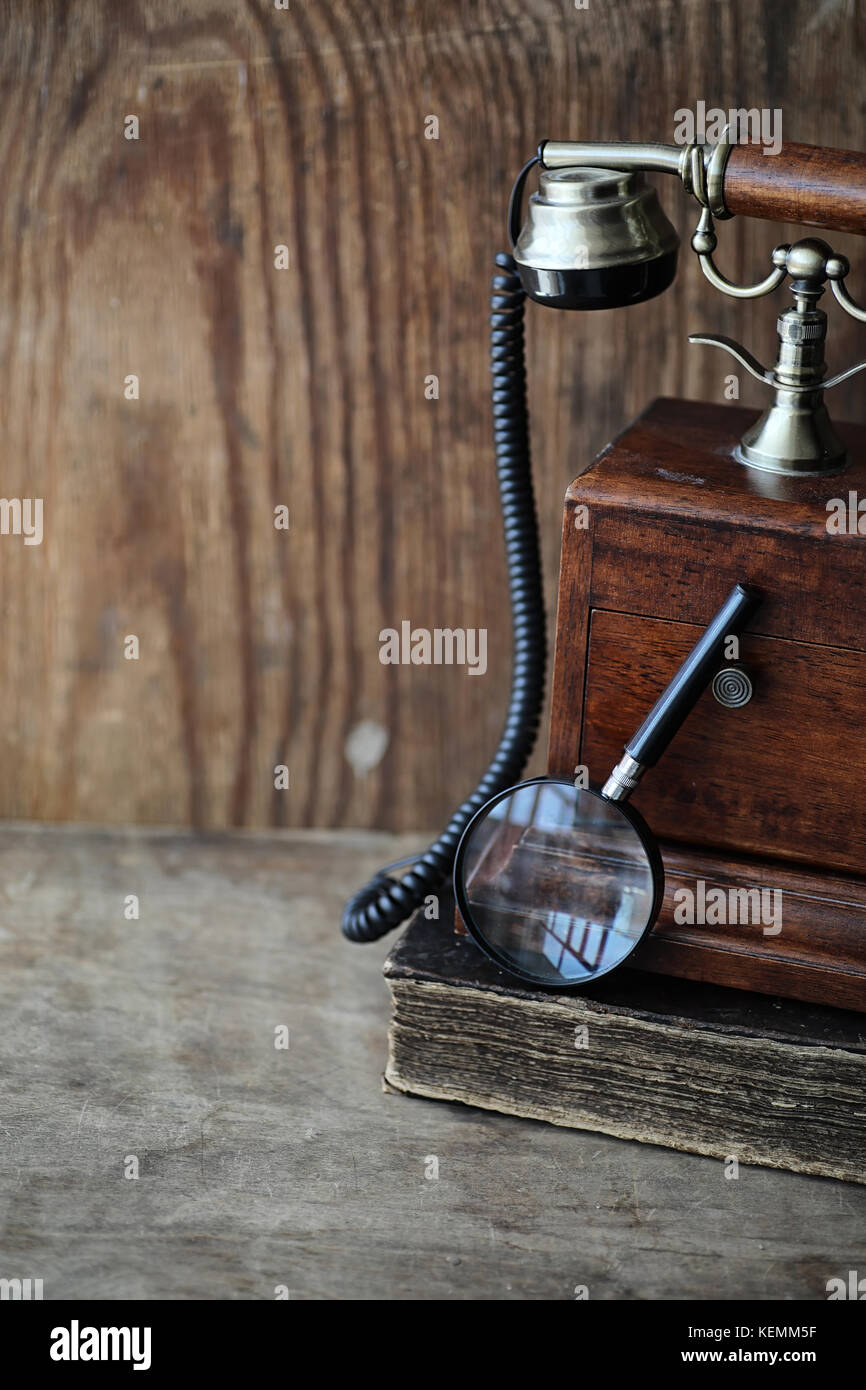 Old telephone and retro book on a wood Stock Photo Alamy