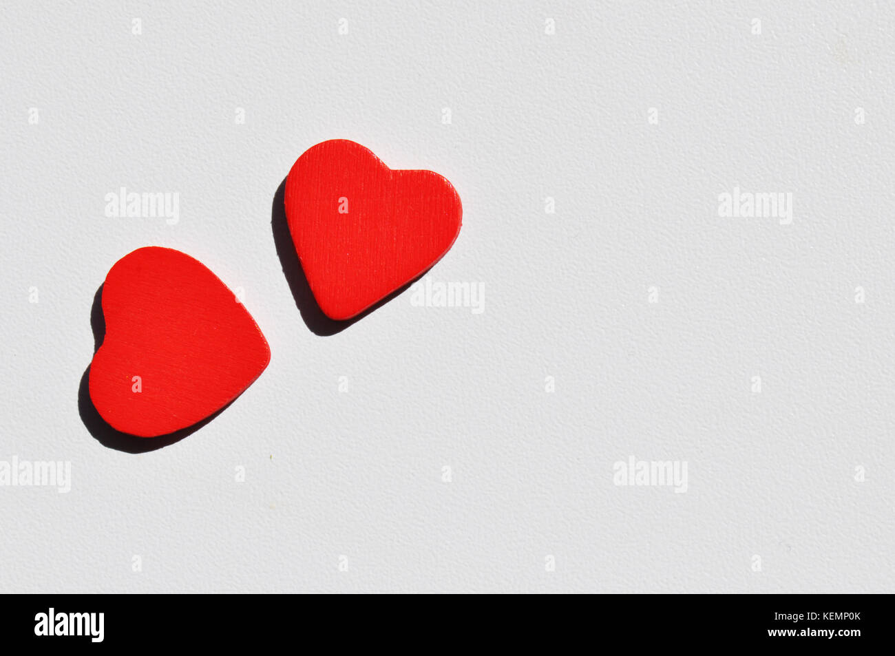 Two wooden hearts on a white background Stock Photo - Alamy