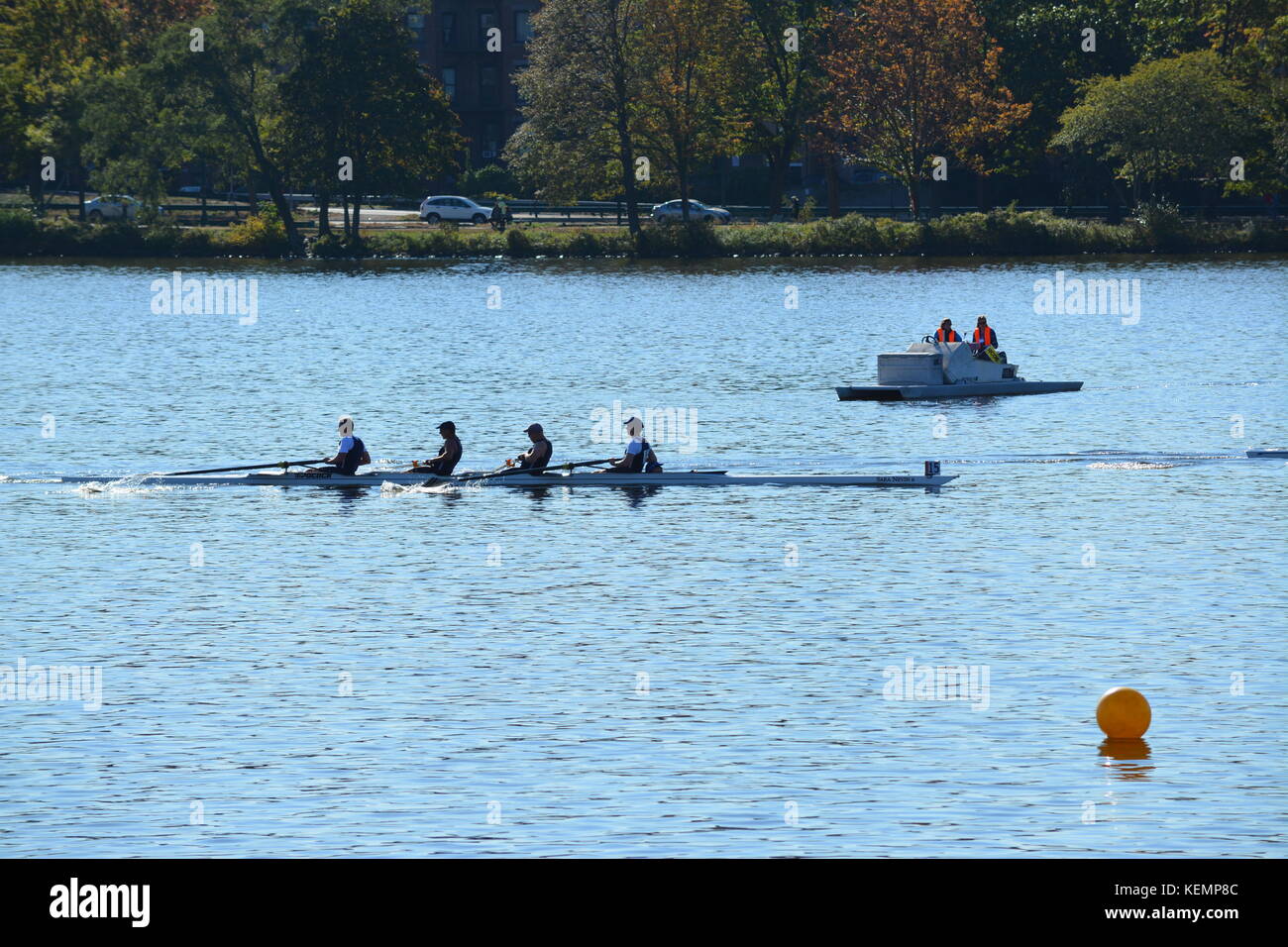 Teams of rowers competing in the Head of the Charles Regatta on the Charles River between Boston