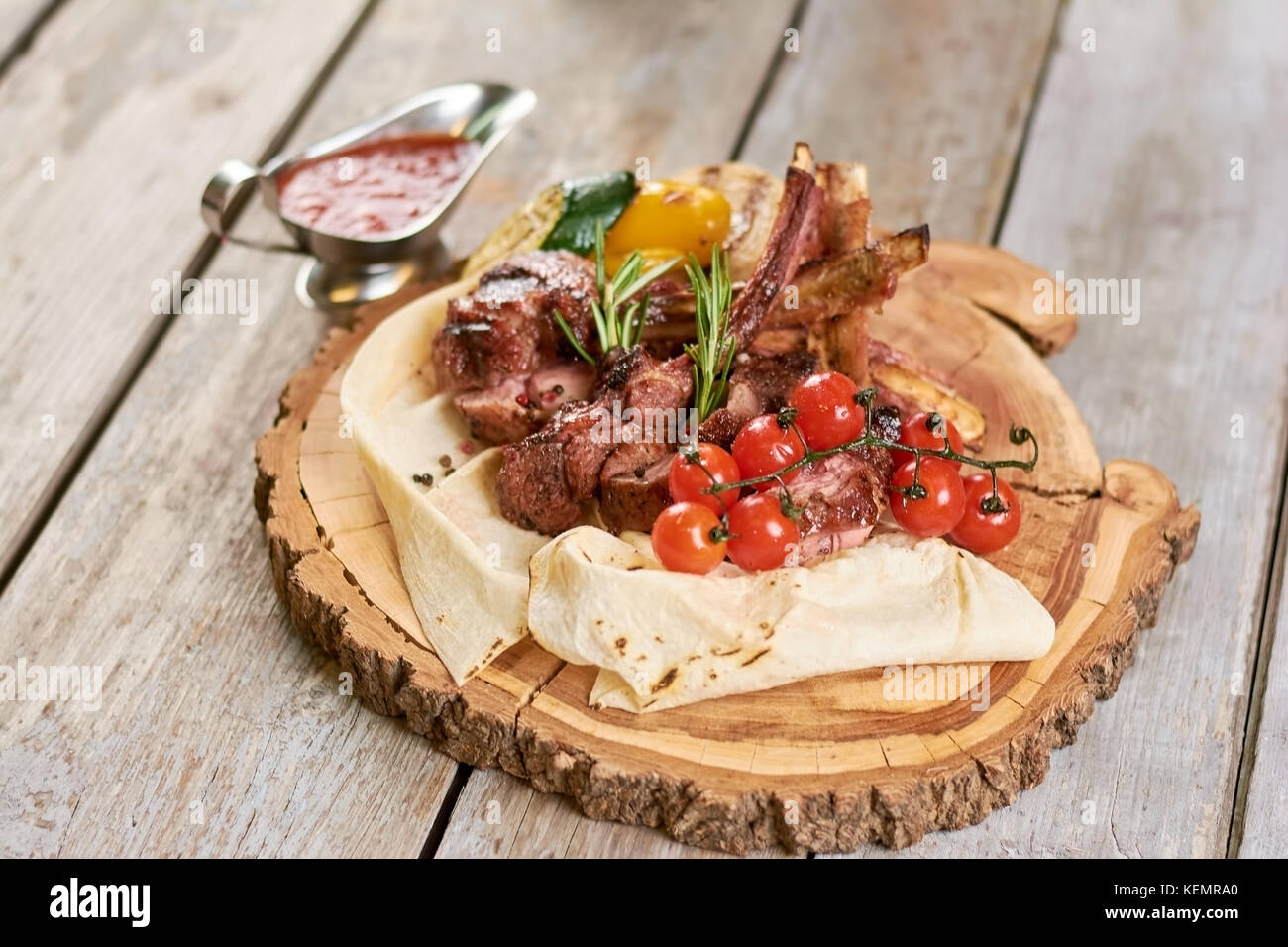 Appetizing calf ribs with cherry tomatoes. Roasted calf ribs with ...