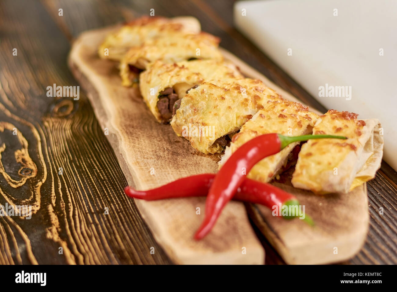 Mexican burrito an red chili pepper. Tortilla wraps with beef meat and