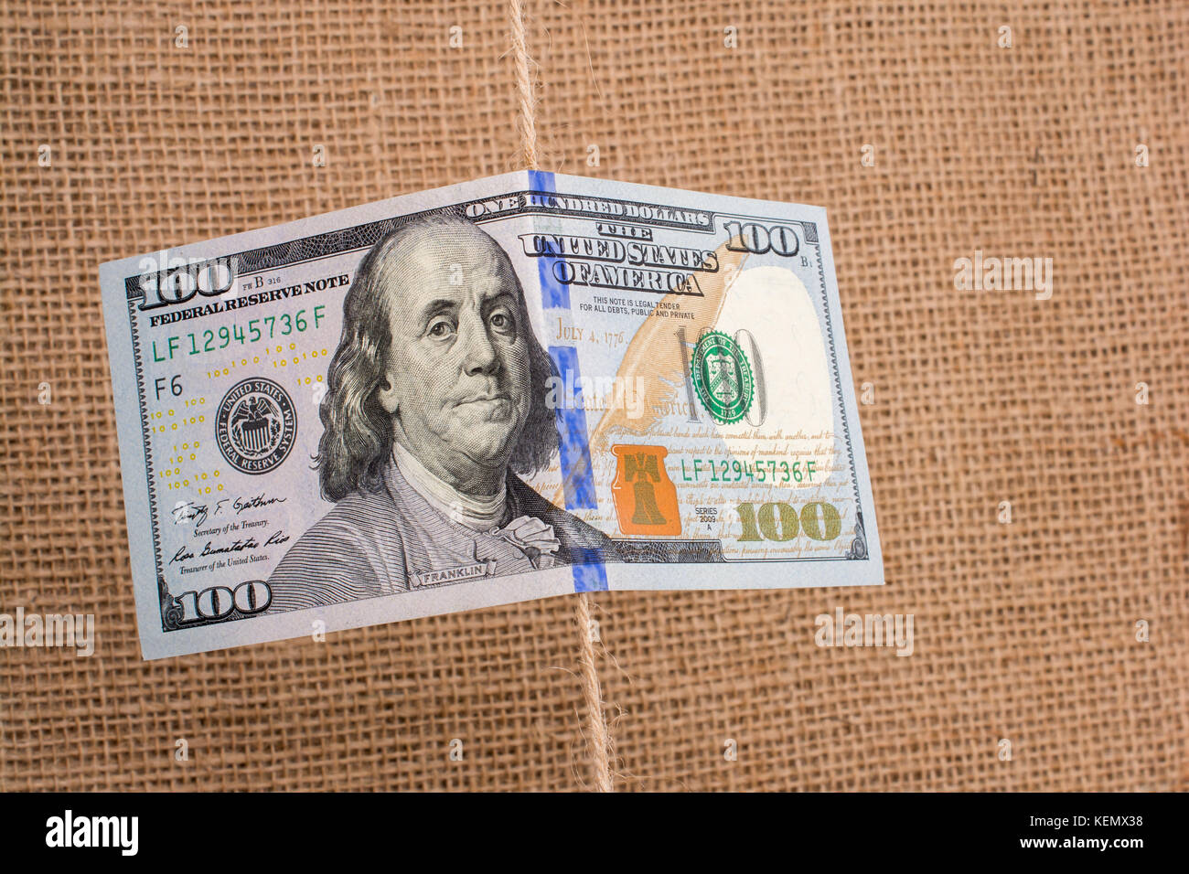 Banknote of US dollar hanging on a linen string Stock Photo - Alamy