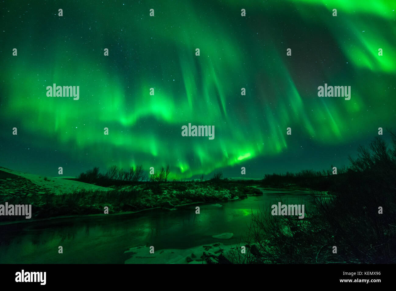 Northern lights above a small river at the mountain plateau in Finnmark Stock Photo
