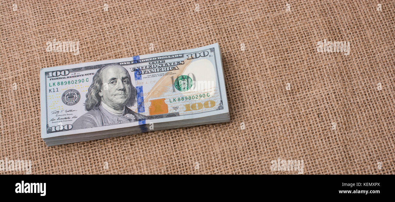 heart icon bundle of US dollar placed on a linen canvas Stock Photo - Alamy