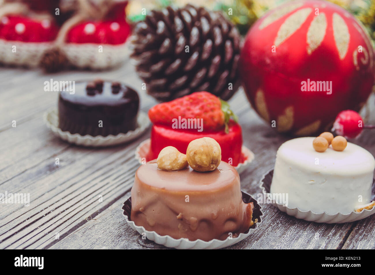 An array of Christmas desserts with colorful   , on wooden board Stock Photo