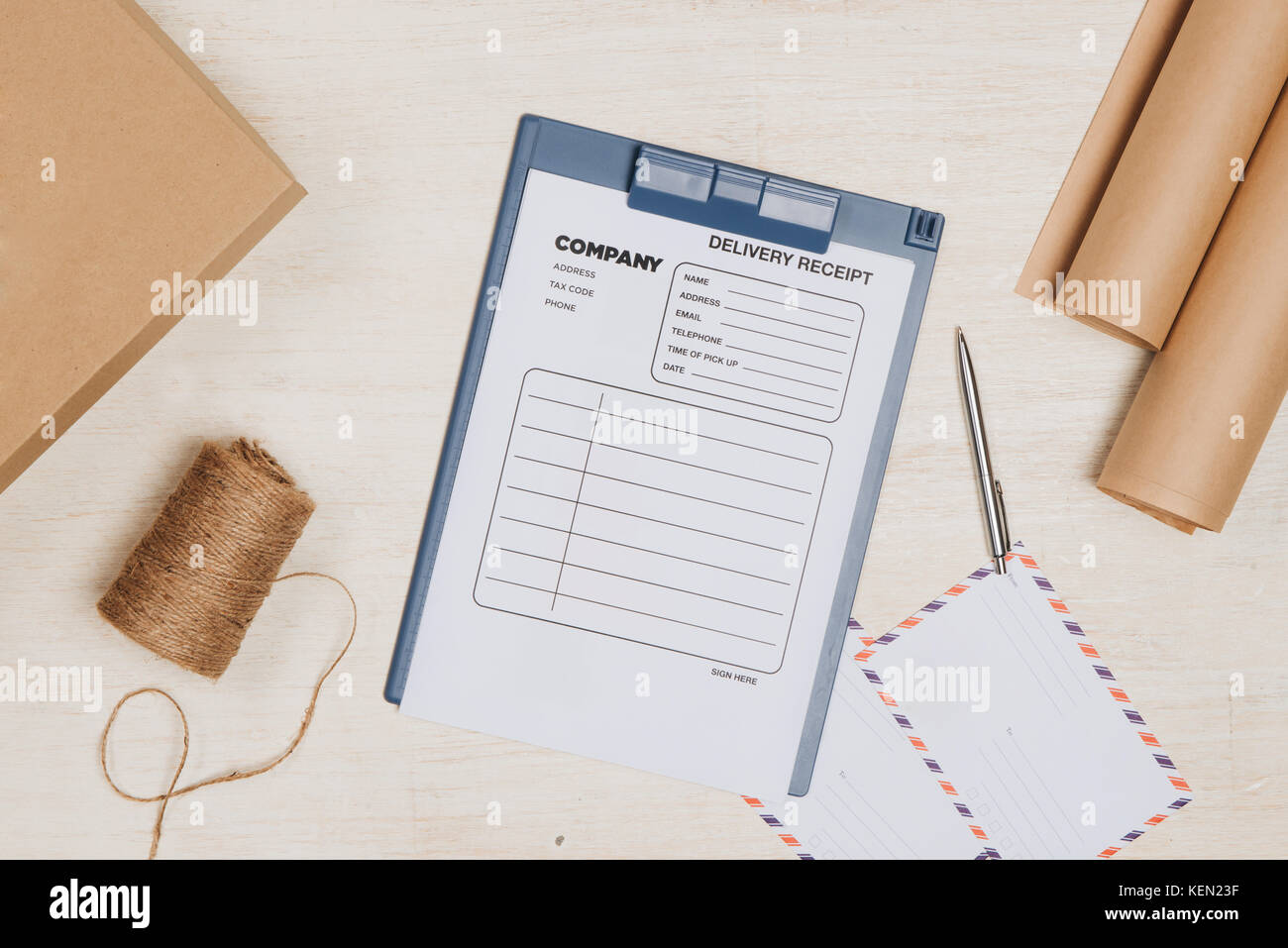 Delivery receipt on cardboard box at table Stock Photo - Alamy