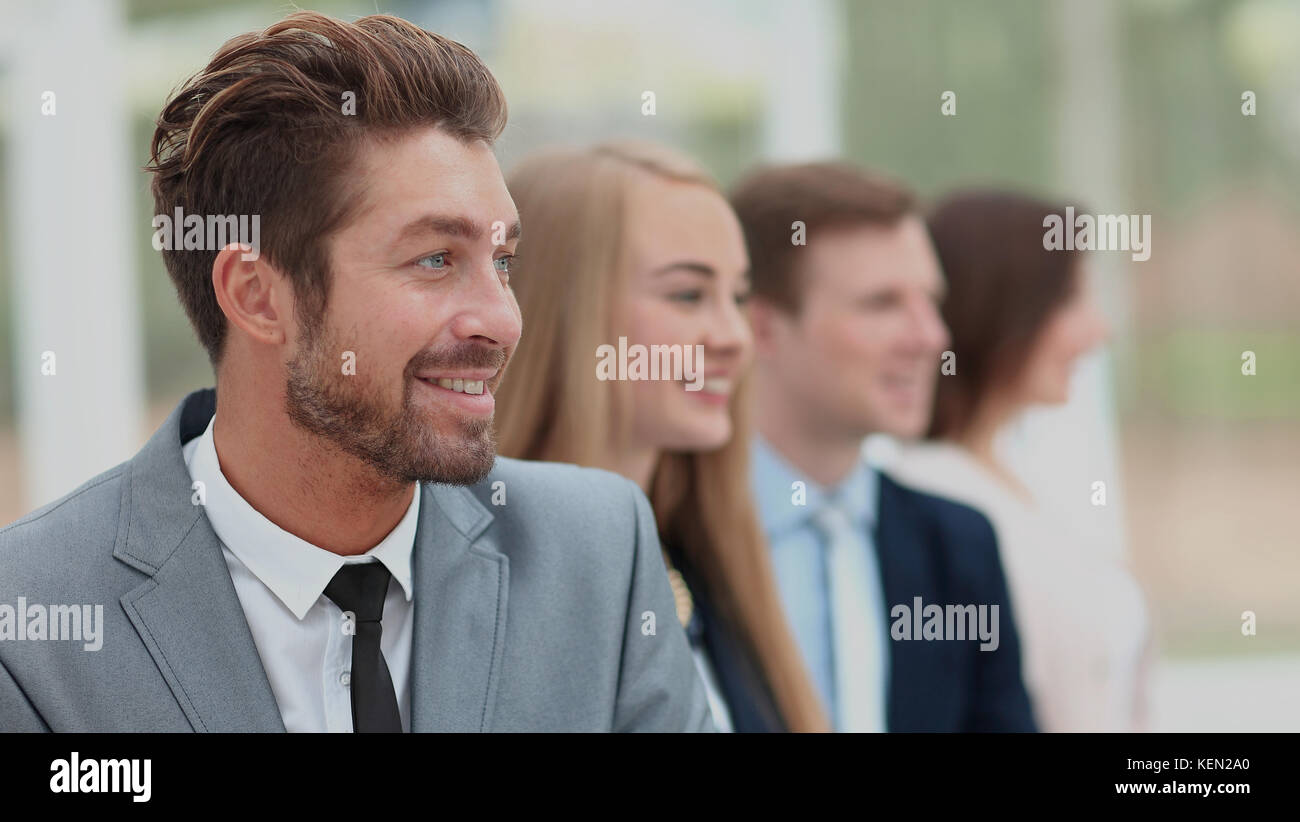 group of business people smiling in an office lined up Stock Photo - Alamy