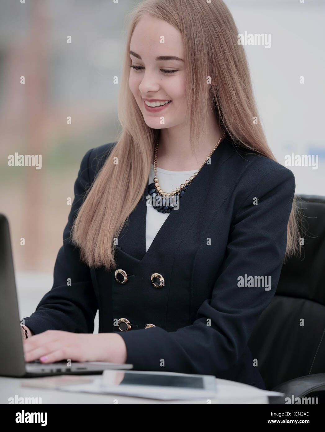 Happy young business woman working in modern office on laptop Stock ...