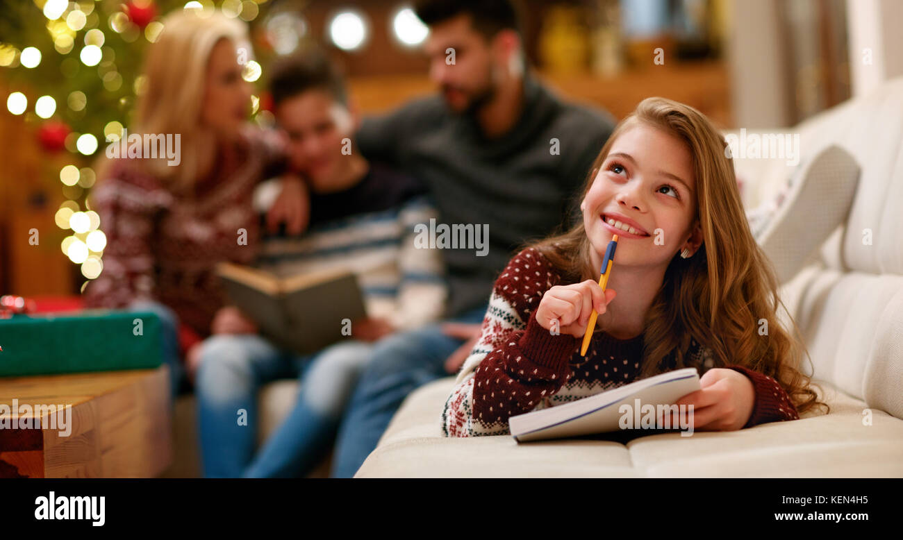 Girl thinking about Xmas wish list for holidays Stock Photo