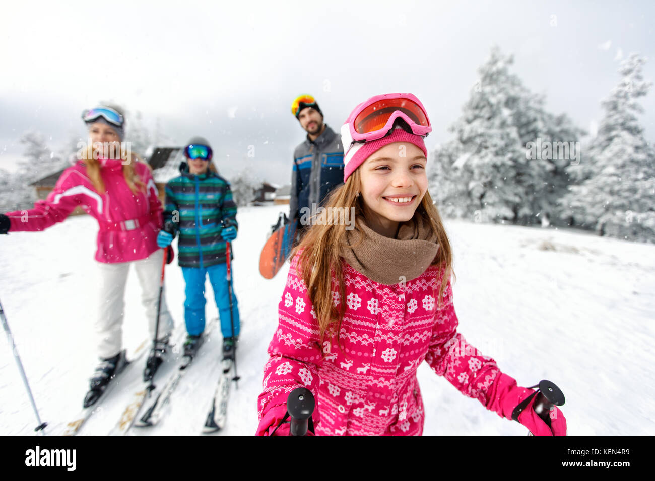 Cute girl skier skiing with family on mountain Stock Photo - Alamy