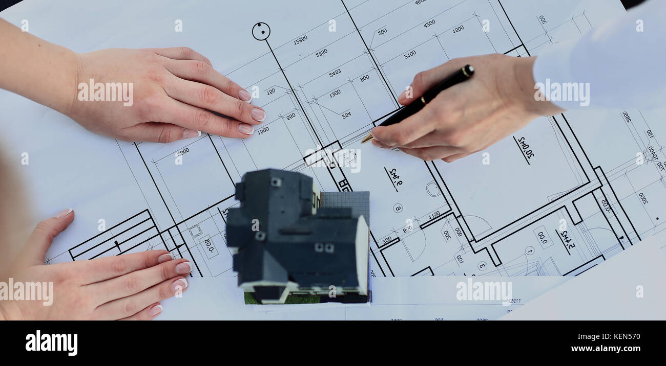 architects model house with plan and blueprints Stock Photo