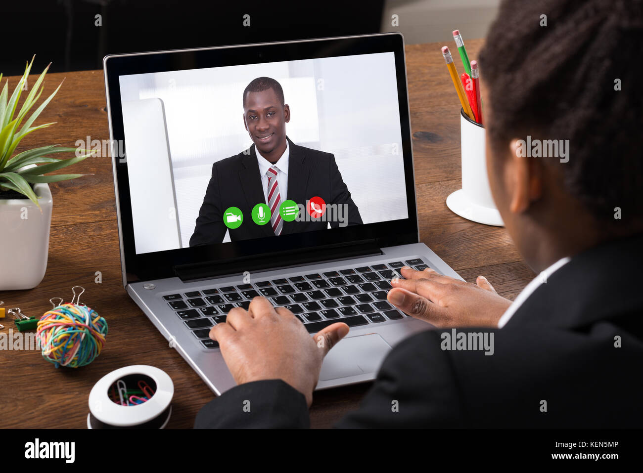Close-up Of Businesswoman Video Conferencing With Colleague On Laptop Stock Photo