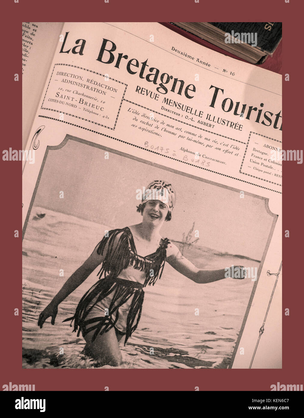1920’s BRITTANY La Bretagne Touristique Newspaper Advertisement  with French bathing belle posing in the sea Brittany France Stock Photo
