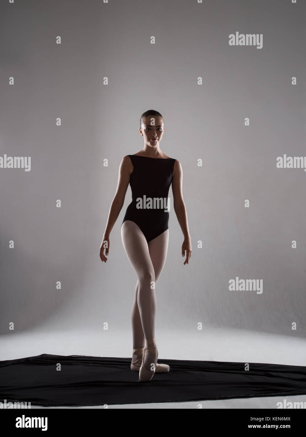 A gorgeous, elegant ballerina in black tights. Studio photography. The  concept of beauty and grace Stock Photo - Alamy