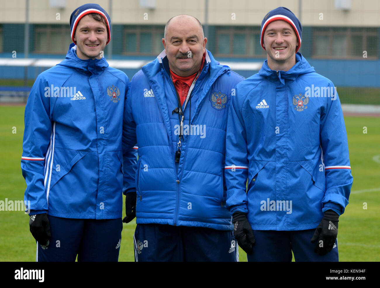 Moscow, Russia - October 5, 2017. Russian international football team manager Stanislav Cherchesov with Miranchuk twin brothers in Moscow. Stock Photo
