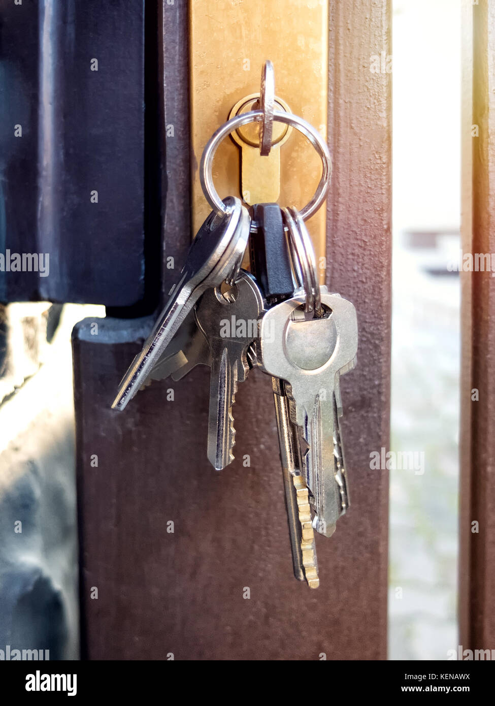 Bunch of keys in the keyhole of the gate Stock Photo - Alamy
