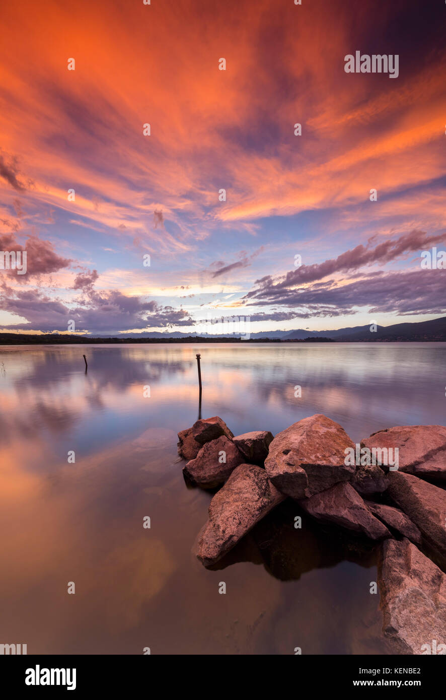 A summer sunset reflecting on Lake Varese at Cazzago Brabbia harbour, Varese Province, Lombardy, Italy. Stock Photo