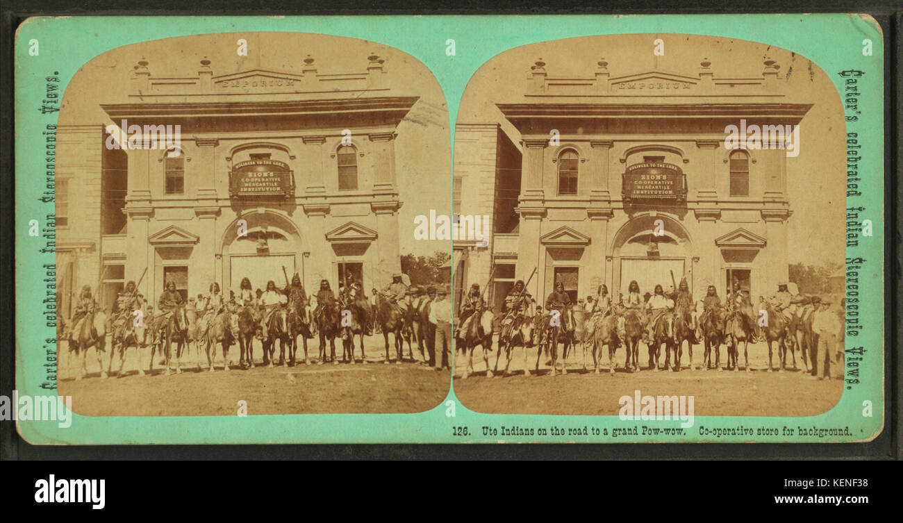 Ute Indians on the road to a grand pow wow. Co operative store for background, by C. W. Carter Stock Photo