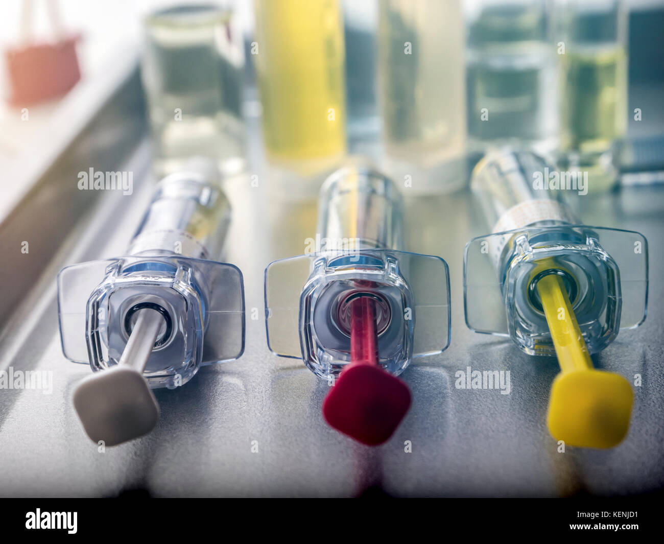 Several vials and syringe in laboratory, conceptual image Stock Photo